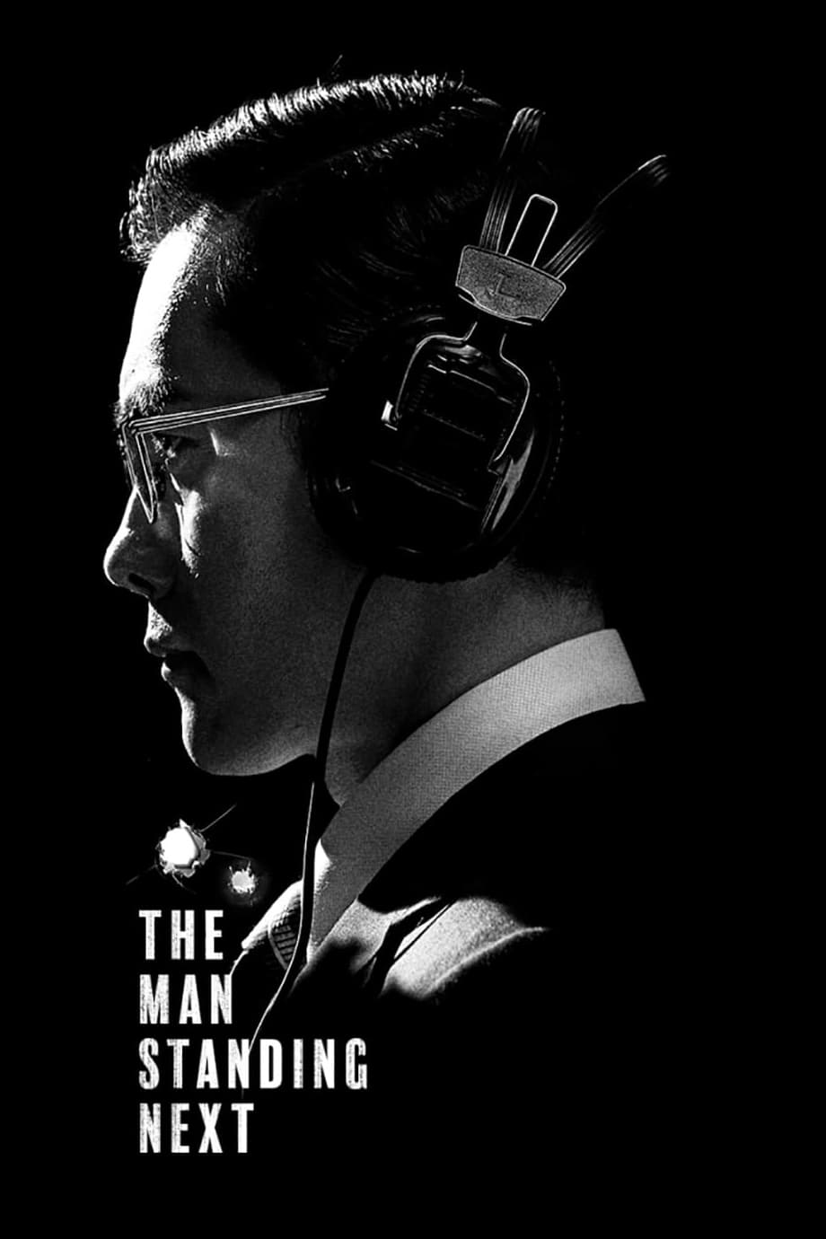 THE MAN STANDING NEXT